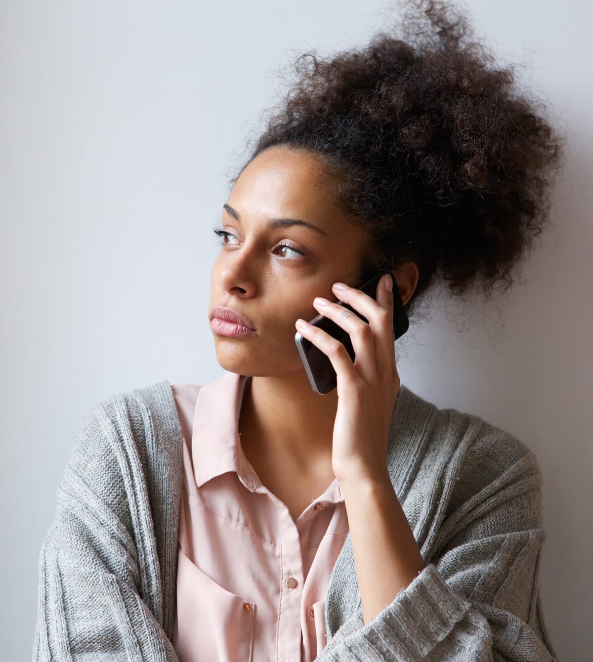 Young woman talking on mobile phone Close up portrait of a young woman talking on mobile phone